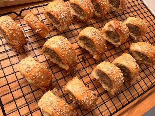 Sesame-seed covered sausage rolls